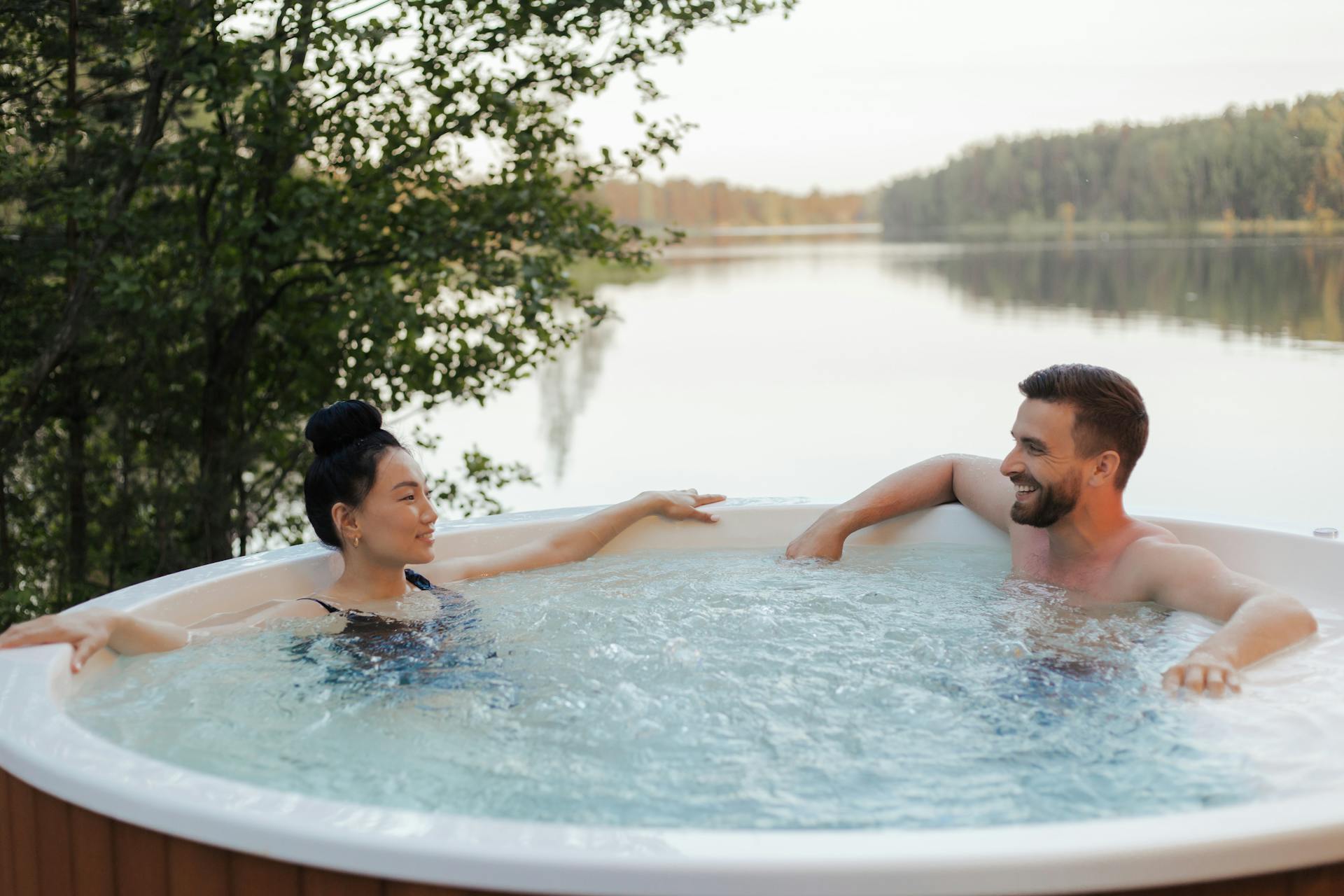 A woman and a man in a home spa for hydrotherapy purposes