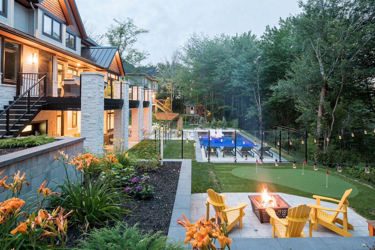 Swimming pool in Atlantic Canada with lounging area, mini golf course and fire pit with chairs